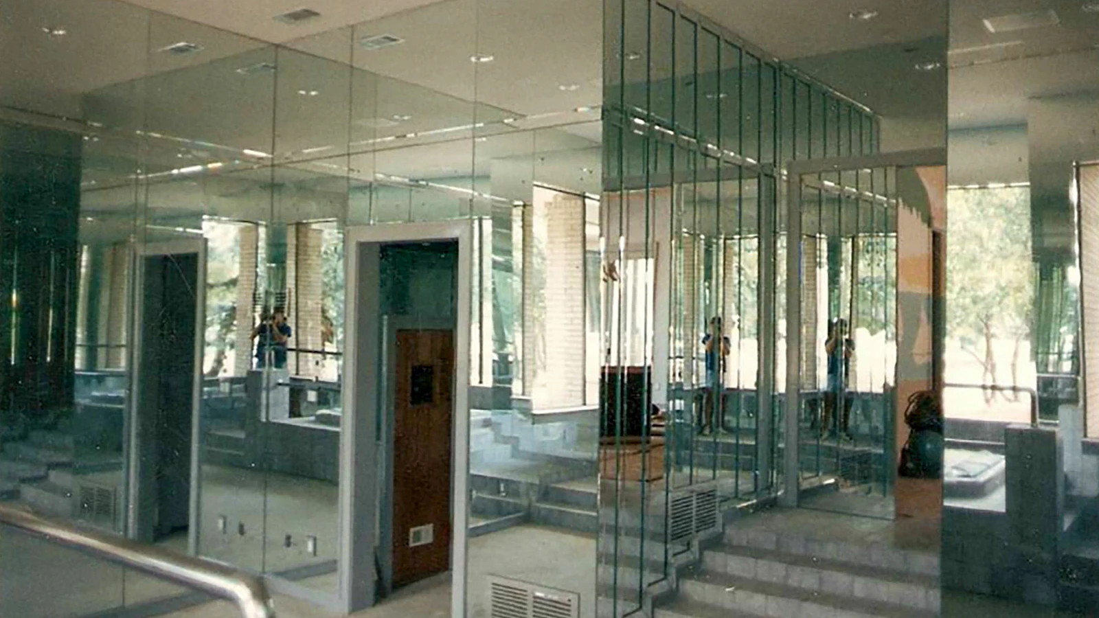 Large custom mirrors installed around a residential vanity