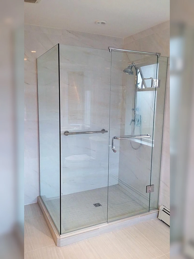 Frameless glass shower enclosure in a bright bathroom