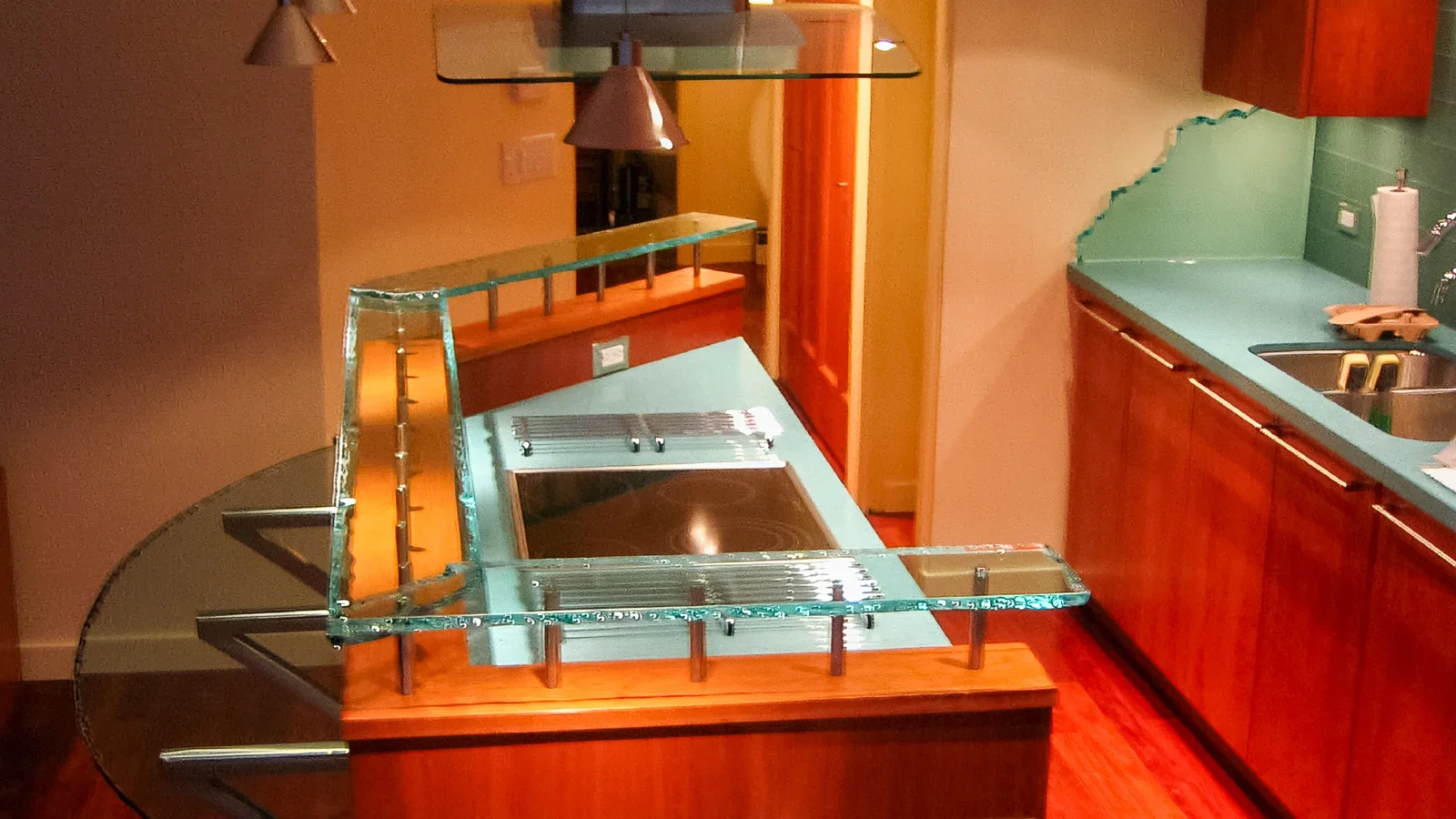overhead view of custom cast glass bar island and matching glass backsplash